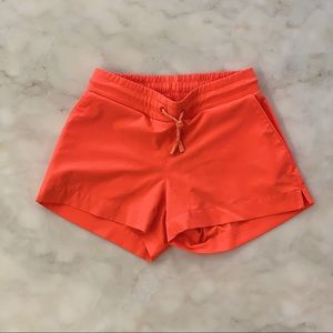 Athleta Girl orange board shorts. Sz M(8-10)